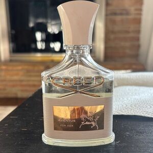 Creed Aventus for Her - Elegant Gold and Cream Bottle